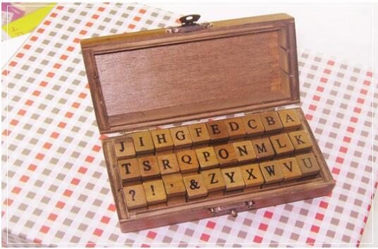 Wooden Alphabet Symbols Stamp Set.